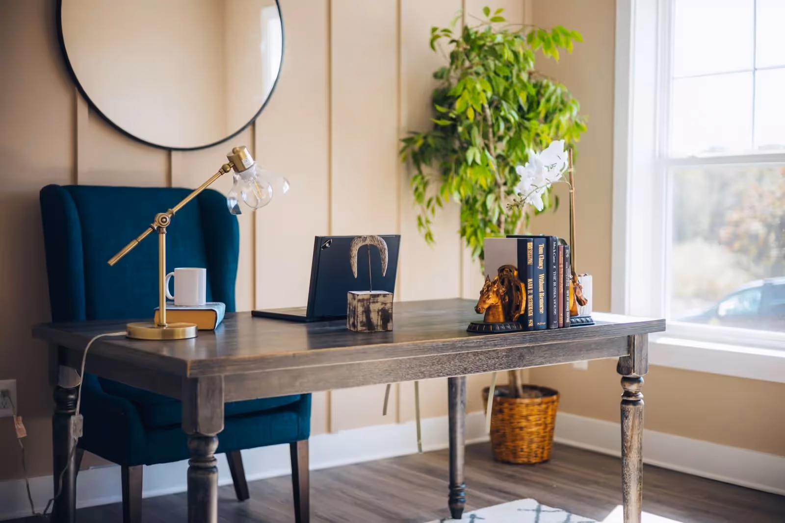 A warm, sunlit counseling office with a desk, plants, and soft natural light